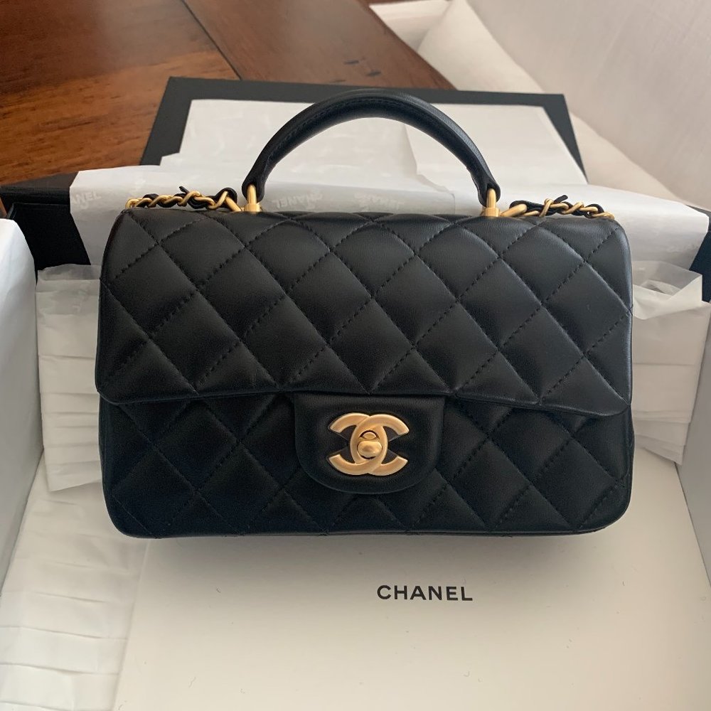 CHANEL Mini Flap with Top handle in Black Lambskin